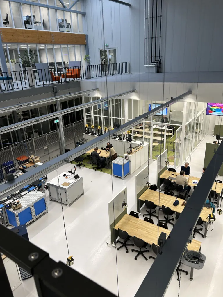 Modern open makerspace with workbenches seen from above