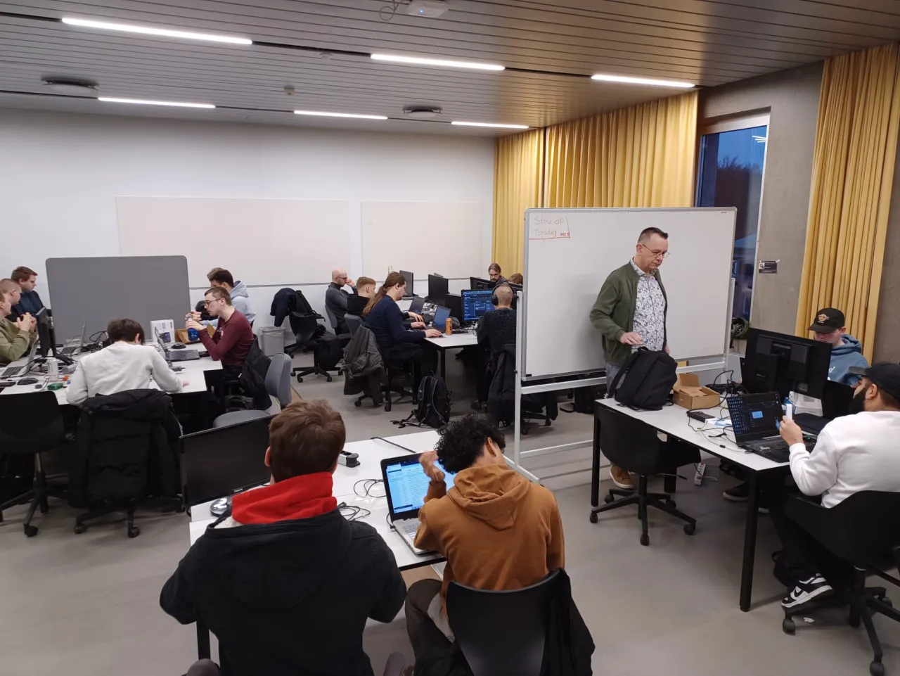 Students working on laptops in a computer lab